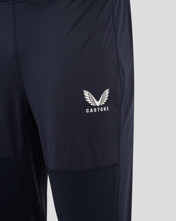 Close up of left thigh displaying the Castore logo on navy training pants