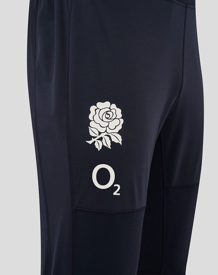 Close up of right thigh showing rose crest and O2 logo on navy fabric with side panel