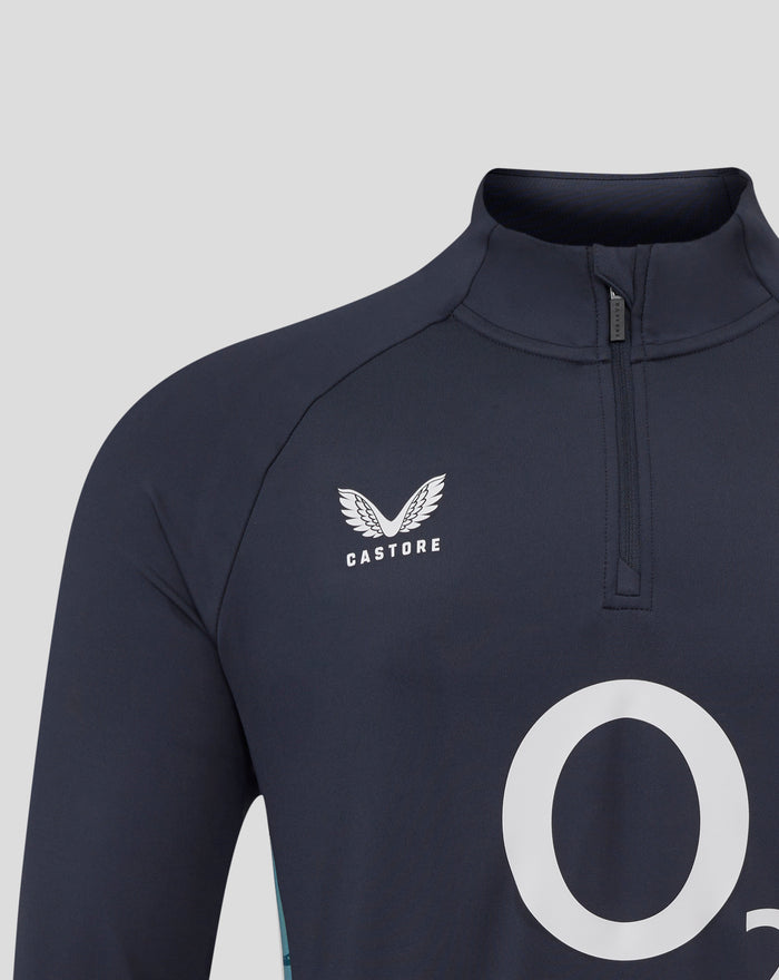 Navy inkwell quarter zip neck with large white graphic on front and partial floral emblem visible.