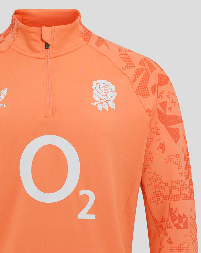 Close up of melon England Cup midlayer top with funnel neck and quarter zip, featuring rose crest and large O2 logo on the front