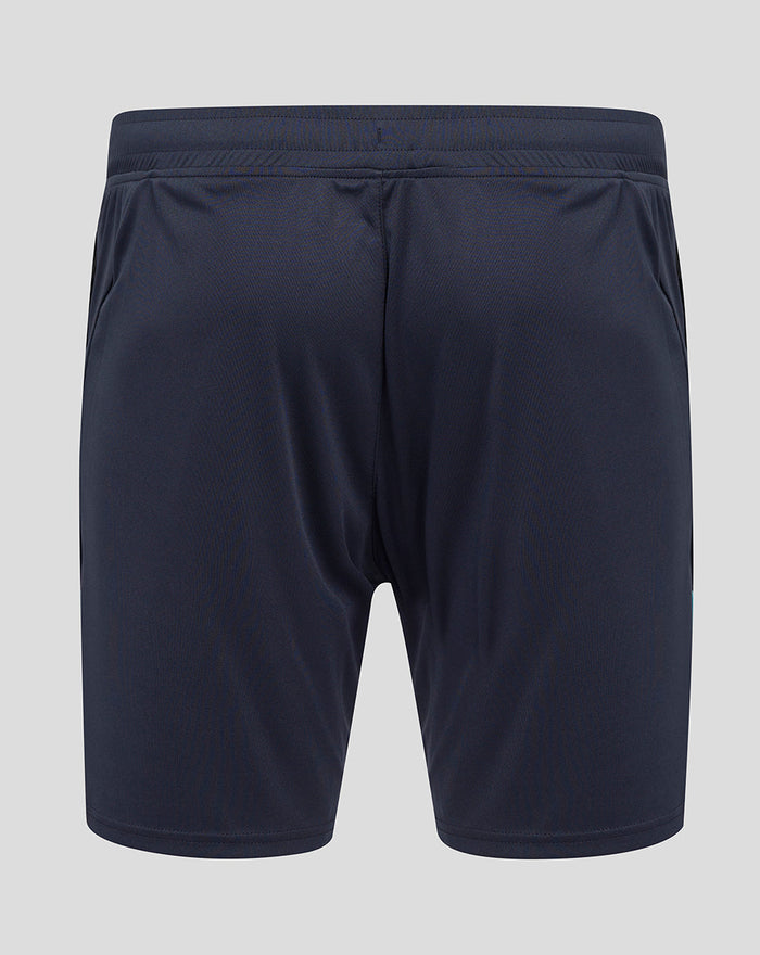 Back view of navy knit shorts showing a rose emblem and O2 on the left leg and Castore logo on the right leg
