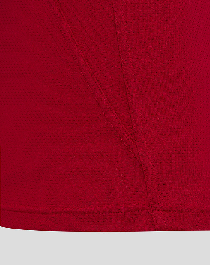 Lower portion of red England rugby jersey with stitched hem and plain paneling