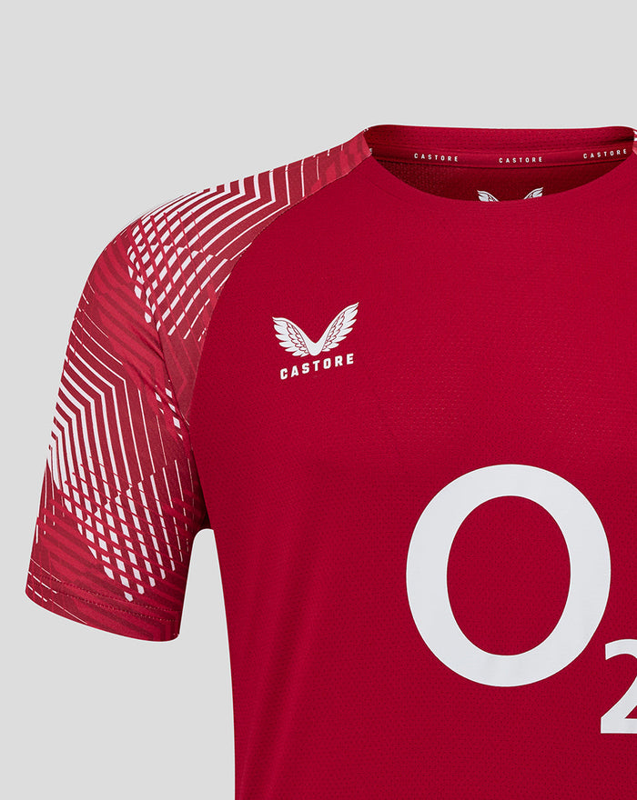 Close up of red England rugby jersey showing geometric sleeve print and Castore logo on chest