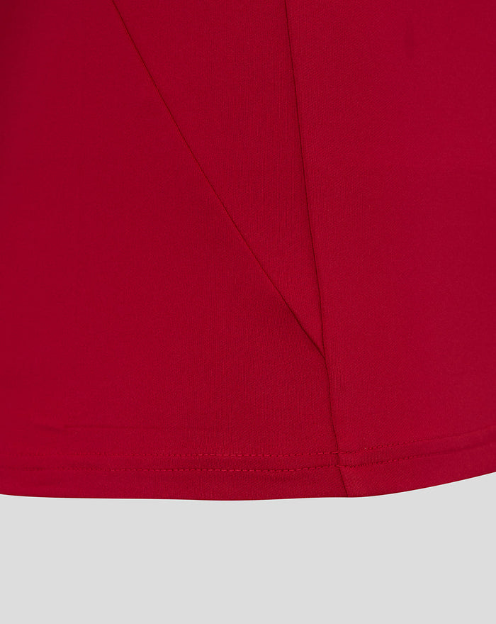 Close-up of red fabric and seam detailing on England Rugby pre match long sleeve drill top