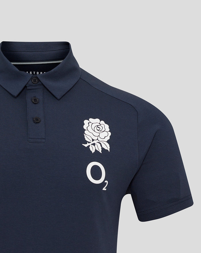 Close-up of navy polo chest featuring white rose crest and O2 logo