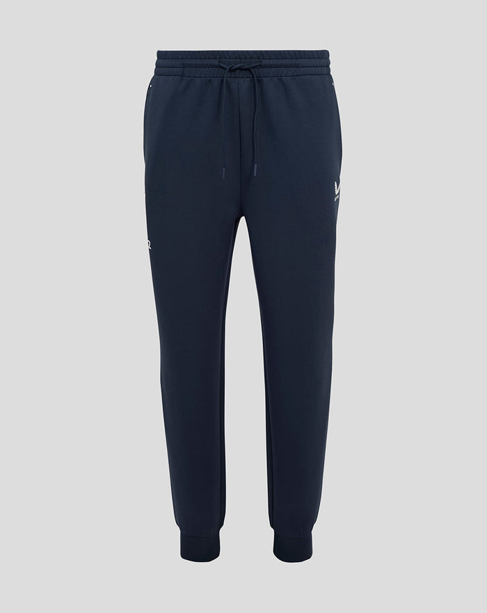 Front view of navy men's England Rugby travel knit pant with external drawcords ribbed cuffs and side zip pockets