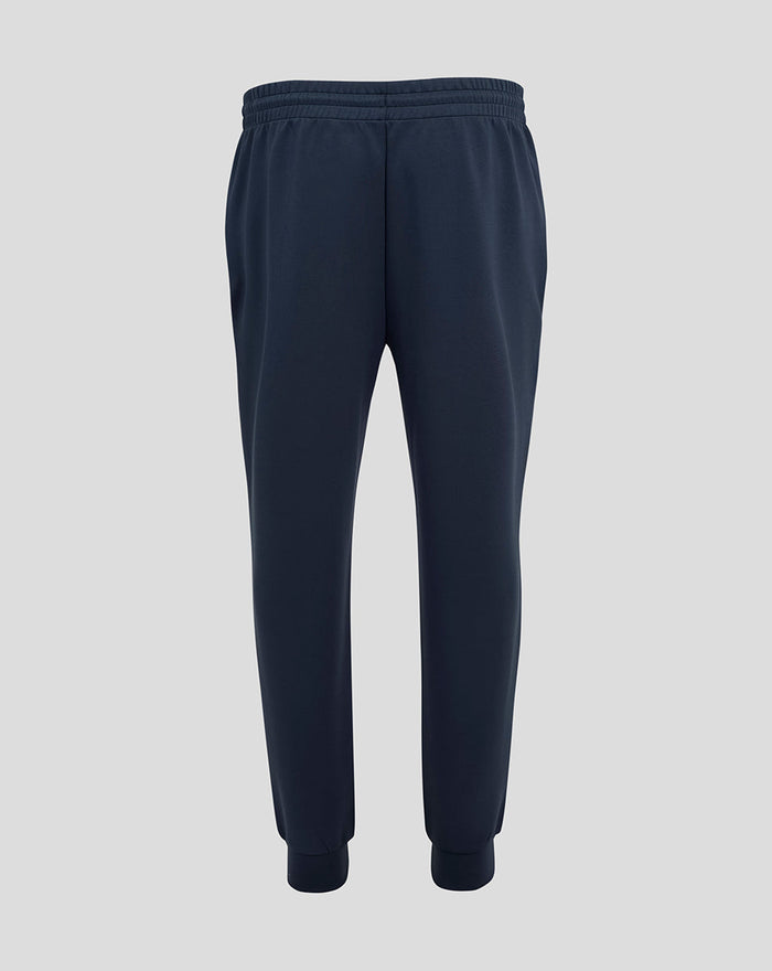 Back view of navy England Rugby travel knit pant with elastic waistband and tapered cuffs