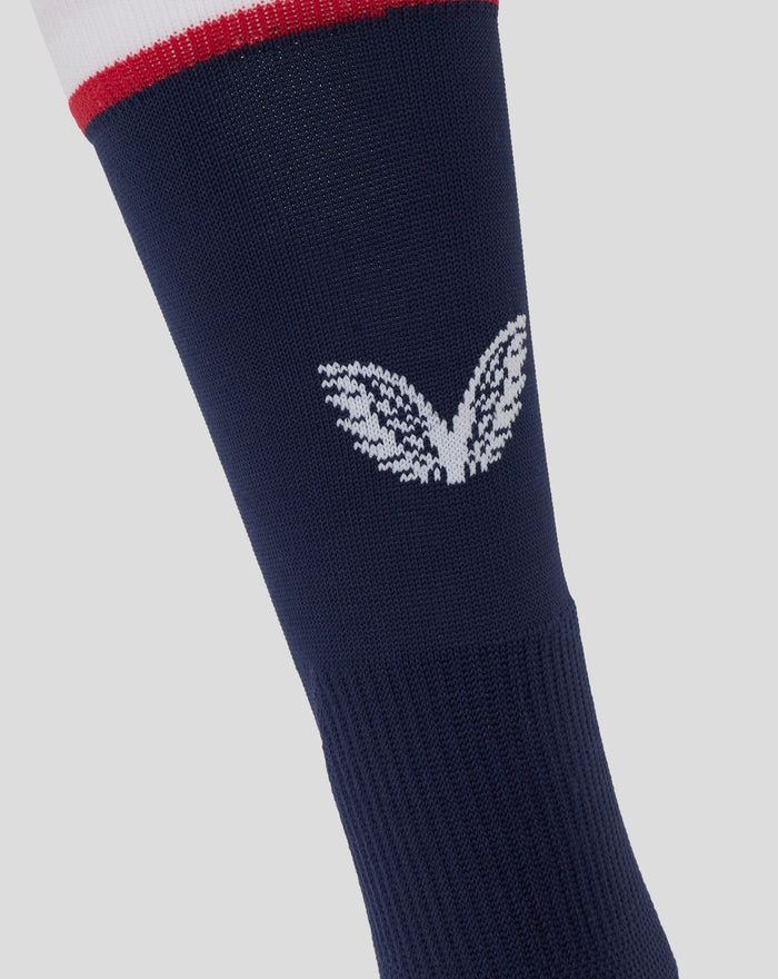 Close up of navy mid calf sock from the Junior England Rugby Home kit showing a white emblem and cuff in white and red