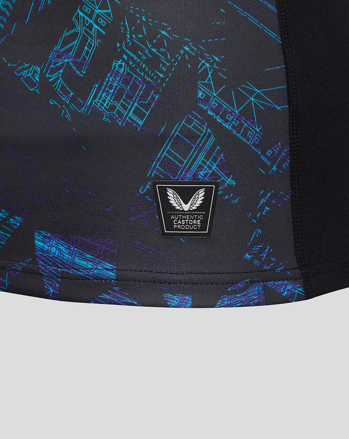 Front chest close up showing blue and purple geometric graphic and a Castore authentic product badge.