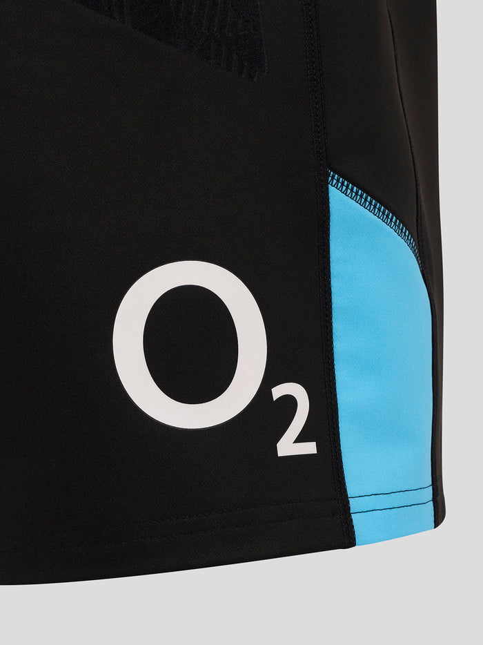 Close-up of the lower back leg of black shorts with blue side panel and prominent O2 branding