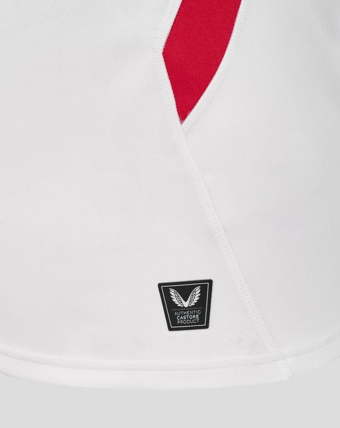 Close-up of white England rugby home shirt showing collar detail chest crest and authentic Castore patch