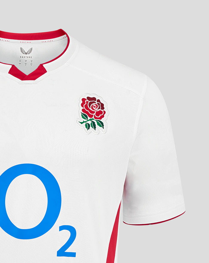 Close up of white Men’s England Rugby 25/26 Home Short Sleeve Shirt showing rose crest on chest and large blue O2 logo.