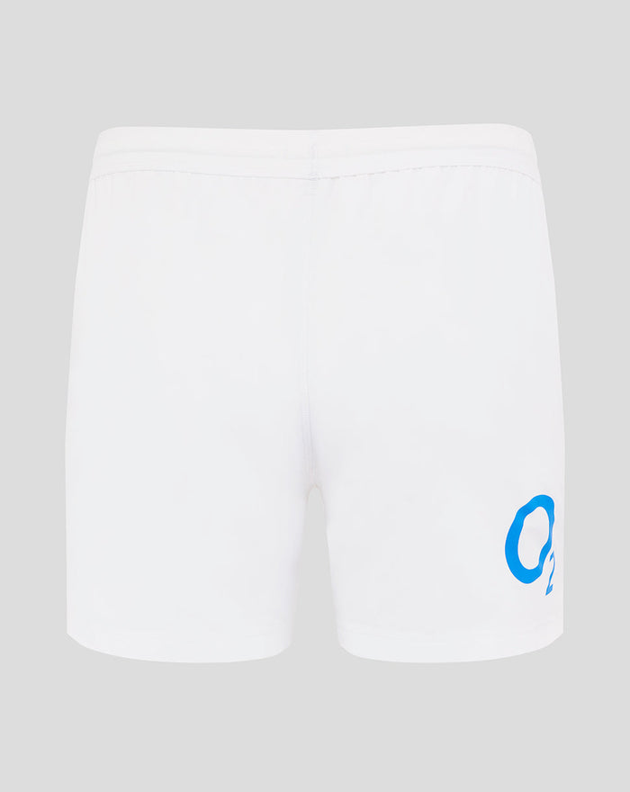 Back view of white England Rugby Home Shorts with red hem trim and large blue O2 logo on the right thigh.