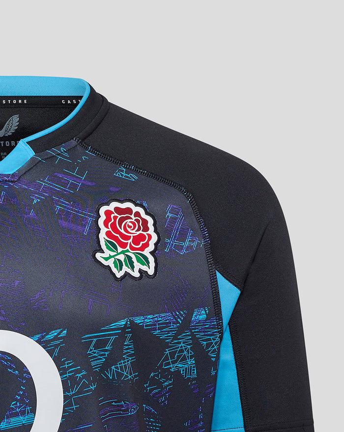 Upper torso of navy England rugby jersey highlighting the rose crest and turquoise sleeve panel.
