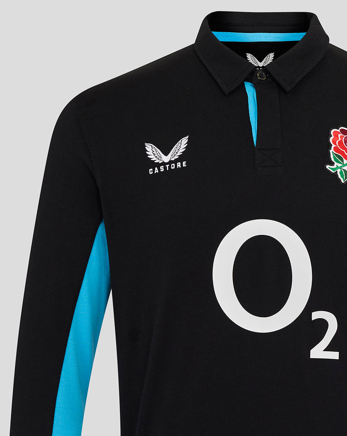 Front close-up of black England Rugby shirt showing rose crest on chest, Castore logo, and large O2 graphic across the front with blue side stripe.