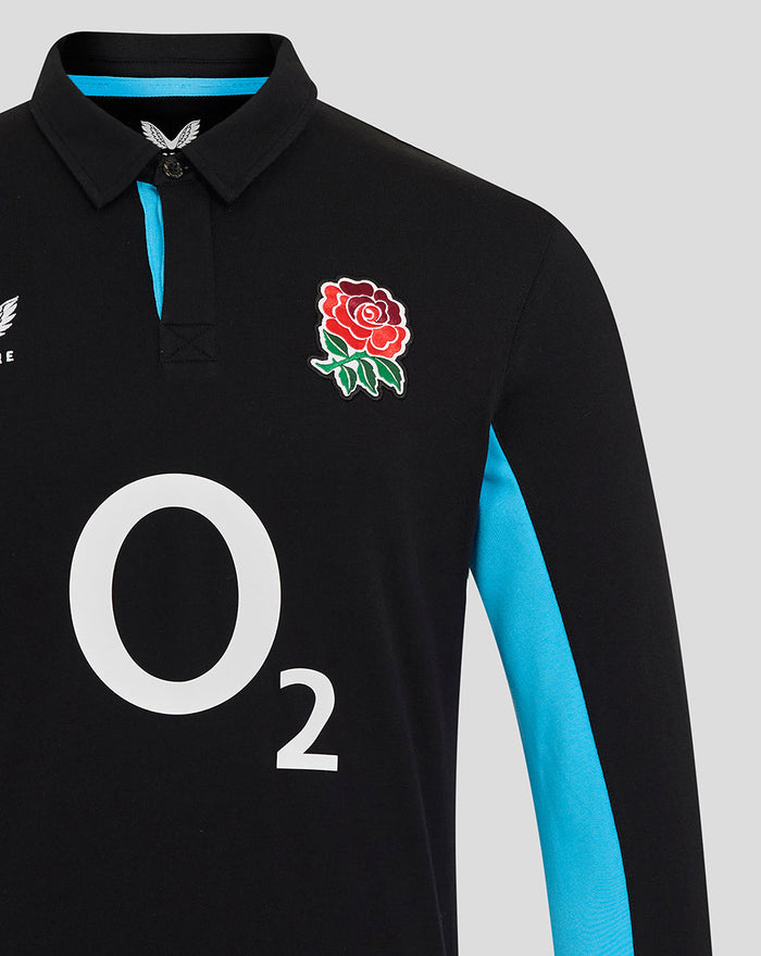 Front view of black England Rugby shirt with O2 across chest, rose crest on left, Castore logo on right, and blue side panels.