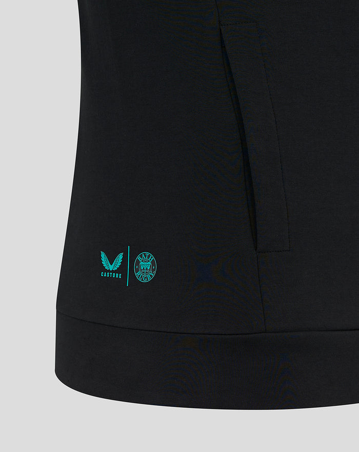 Bottom left hem detail with turquoise Castore and Bath Rugby crest logos on the black hoodie