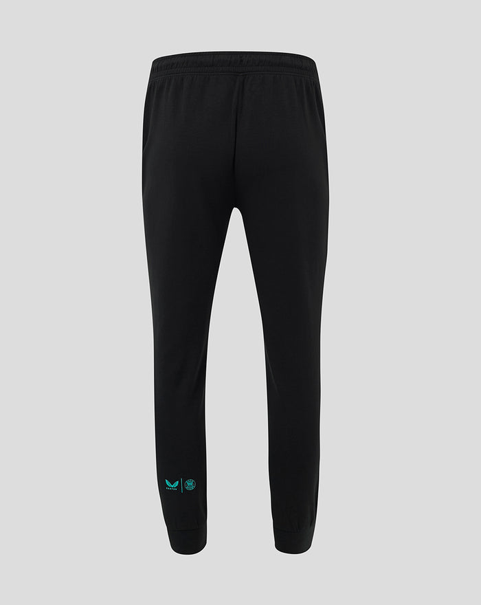 Back view of black Travel Pants with turquoise Castore wing and Bath Rugby crest near the left ankle