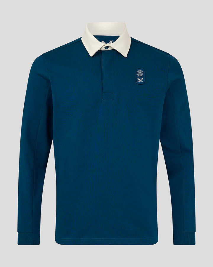 Front view of teal Junior Lifestyle Rugby Shirt with white collar and left chest badge.