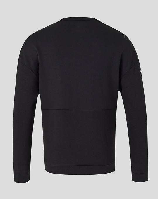 Back view of black unisex travel crew sweatshirt with clean hem