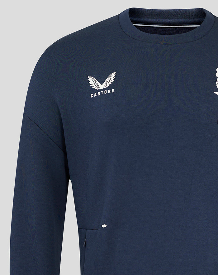 Close up of Castore branding on the left chest of the navy England Rugby Travel Crew Sweatshirt.