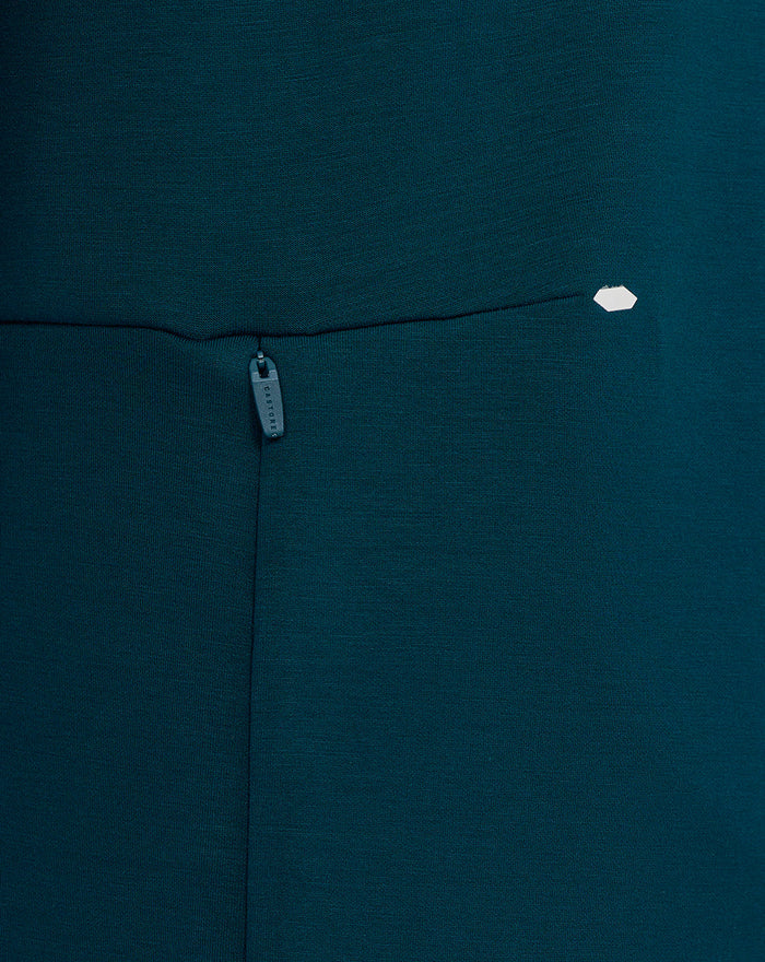 Teal Travel Crew Sweatshirt close-up of side zip pocket and small hex badge.