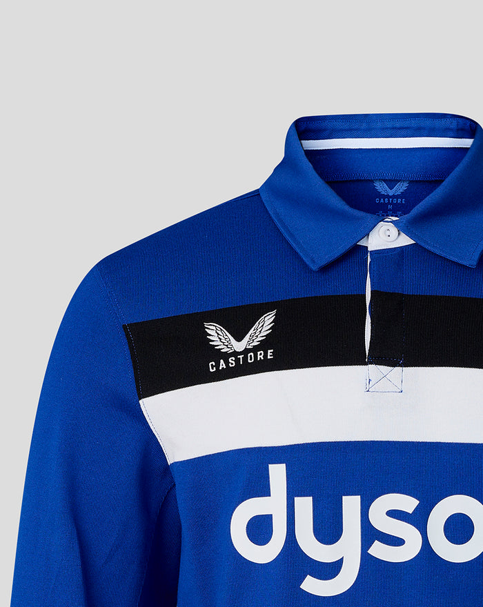 Close-up of Bath Rugby blue home shirt showing collar crest and sponsor stripe across chest