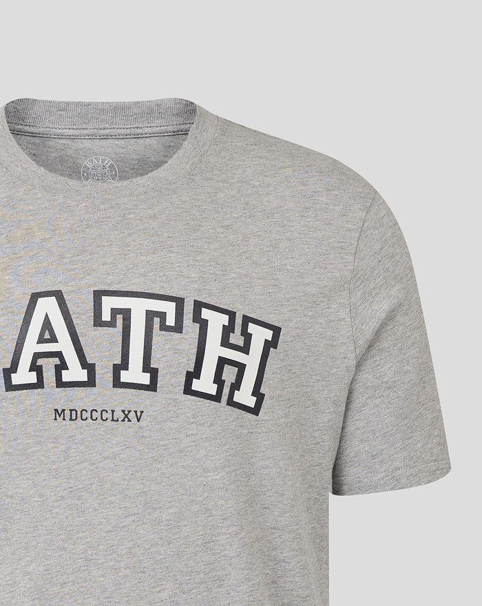 Shoulder and neckline view of a heather grey Bath Rugby Varsity Tee showing large BATH lettering and MDCCCXLV.